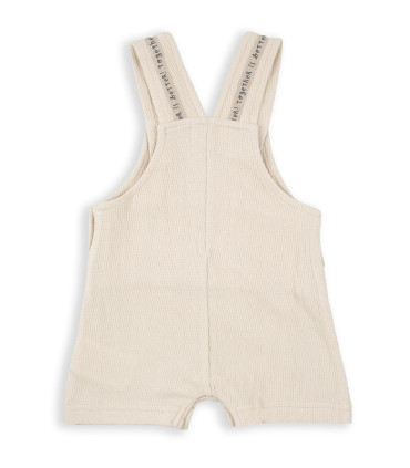 Peto Corto Beige Bebé Niño  Inicio  Peto corto para bebé niño en tono beig, confeccionado en